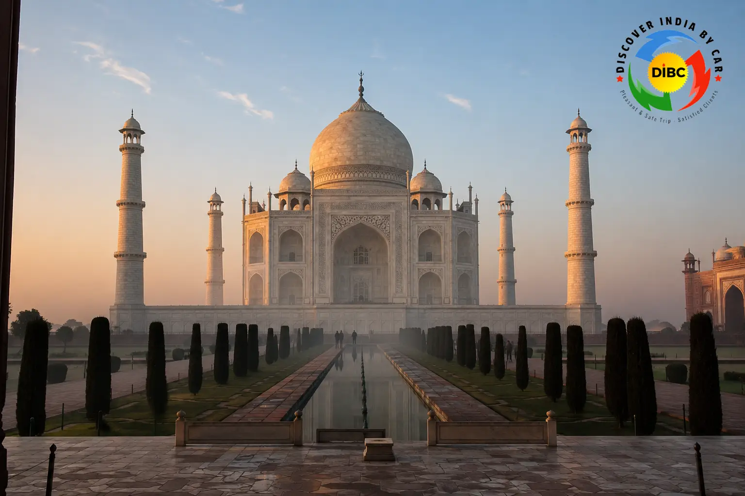 Taj Mahal at sunrise with soft pink light on the marble dome, Agra